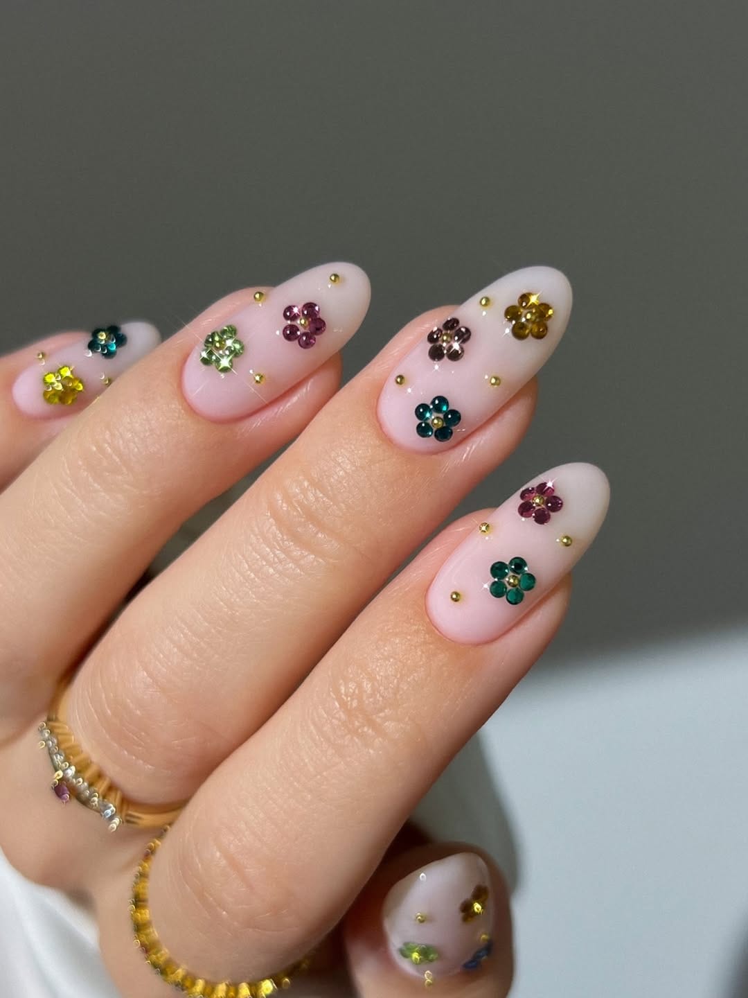 Milky white nails with rhinestone flower detail for simple summer nails