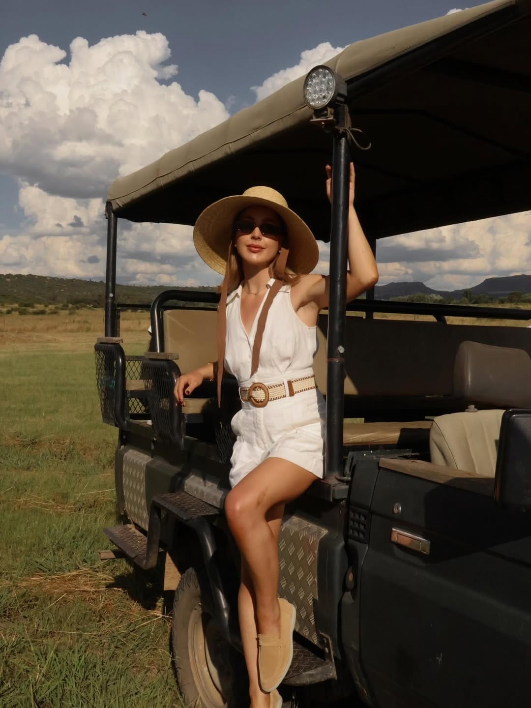 White linen halter romper with straw hat for a breezy country summer outfit