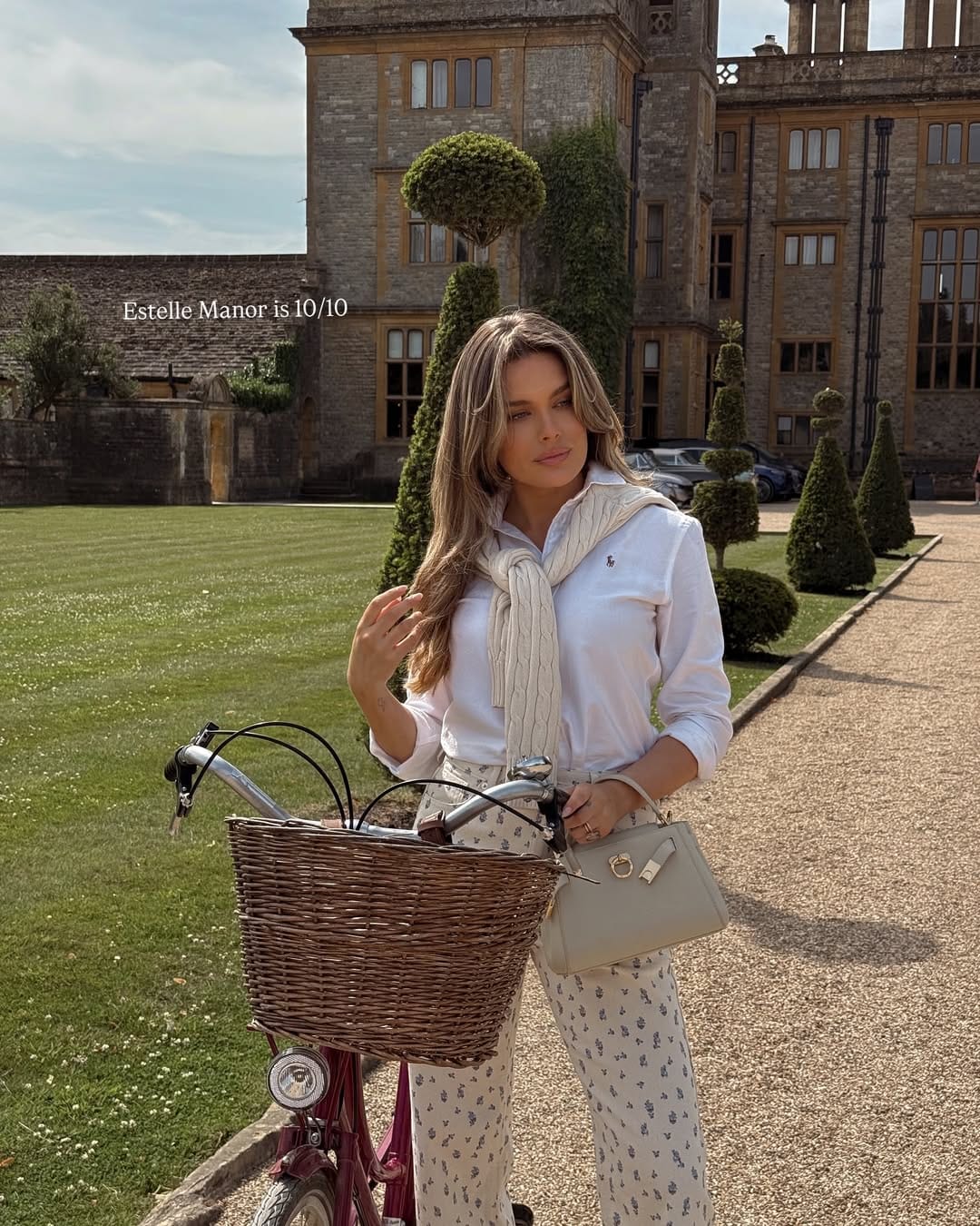 White shirt styled with cable-knit and floral wide-leg trousers for a country summer outfit