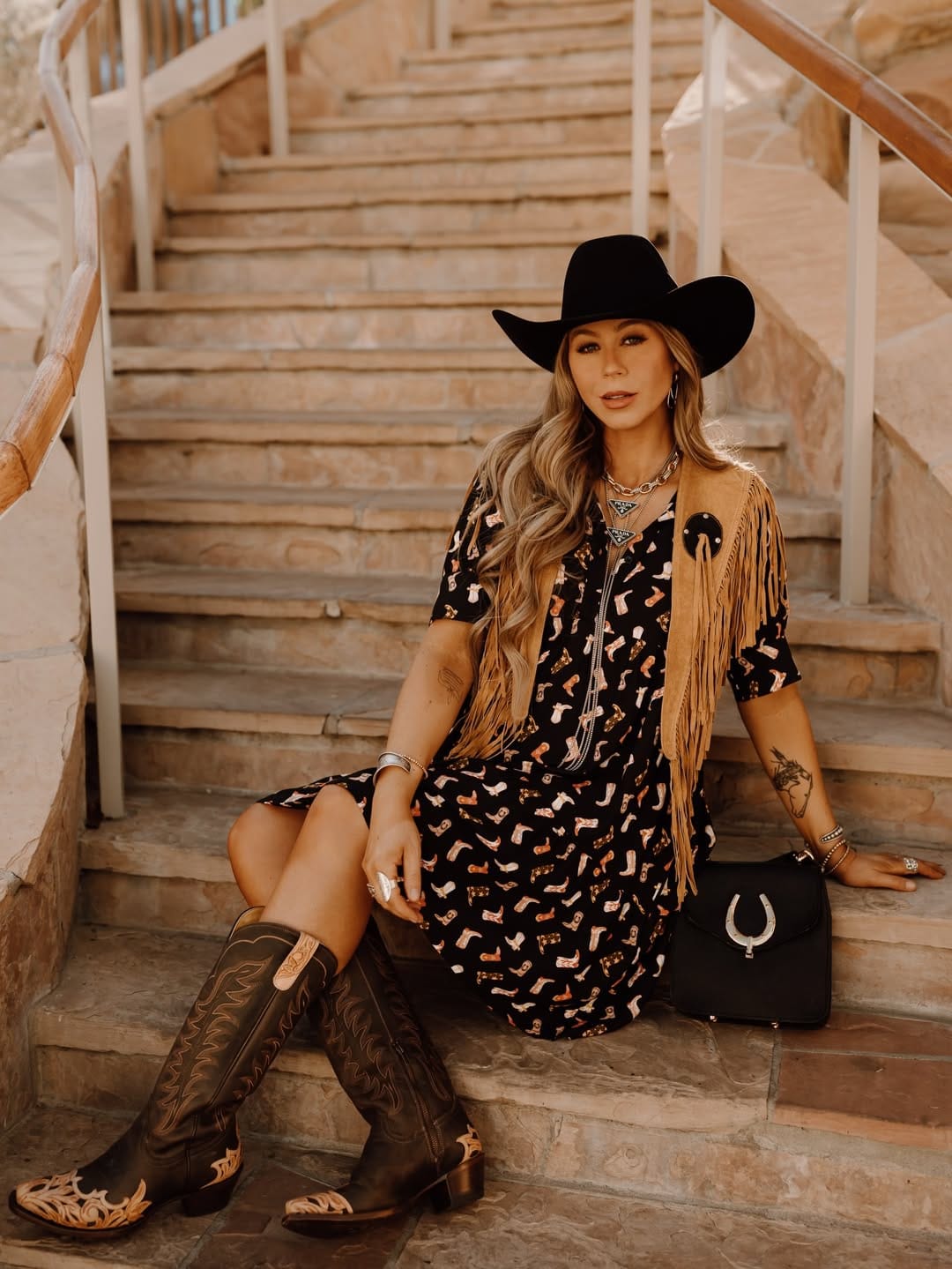 Black cowboy boot print dress with tan fringe vest for a Western country summer outfit