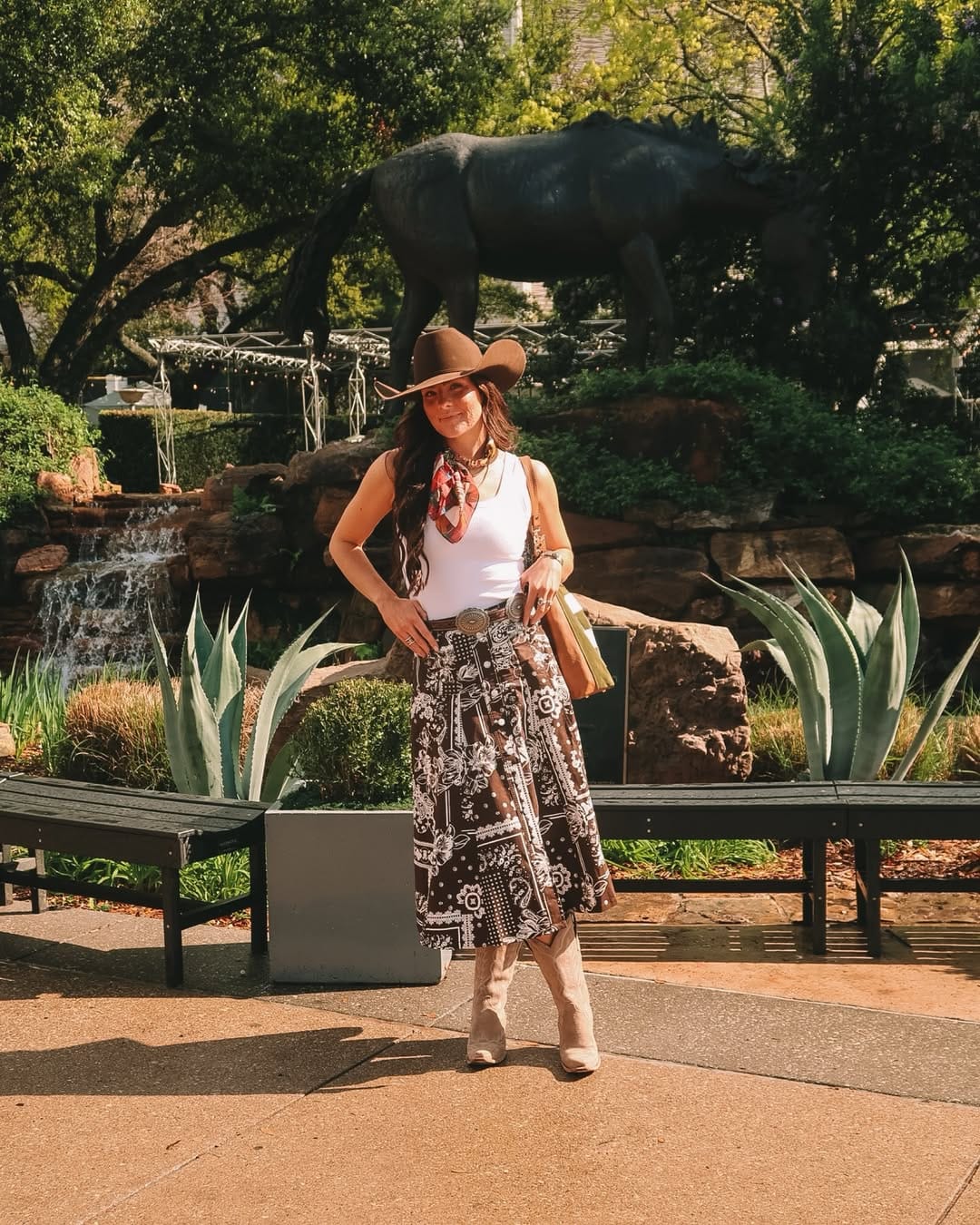 Brown paisley midi skirt with white tank top and concho belt for a boho country summer style