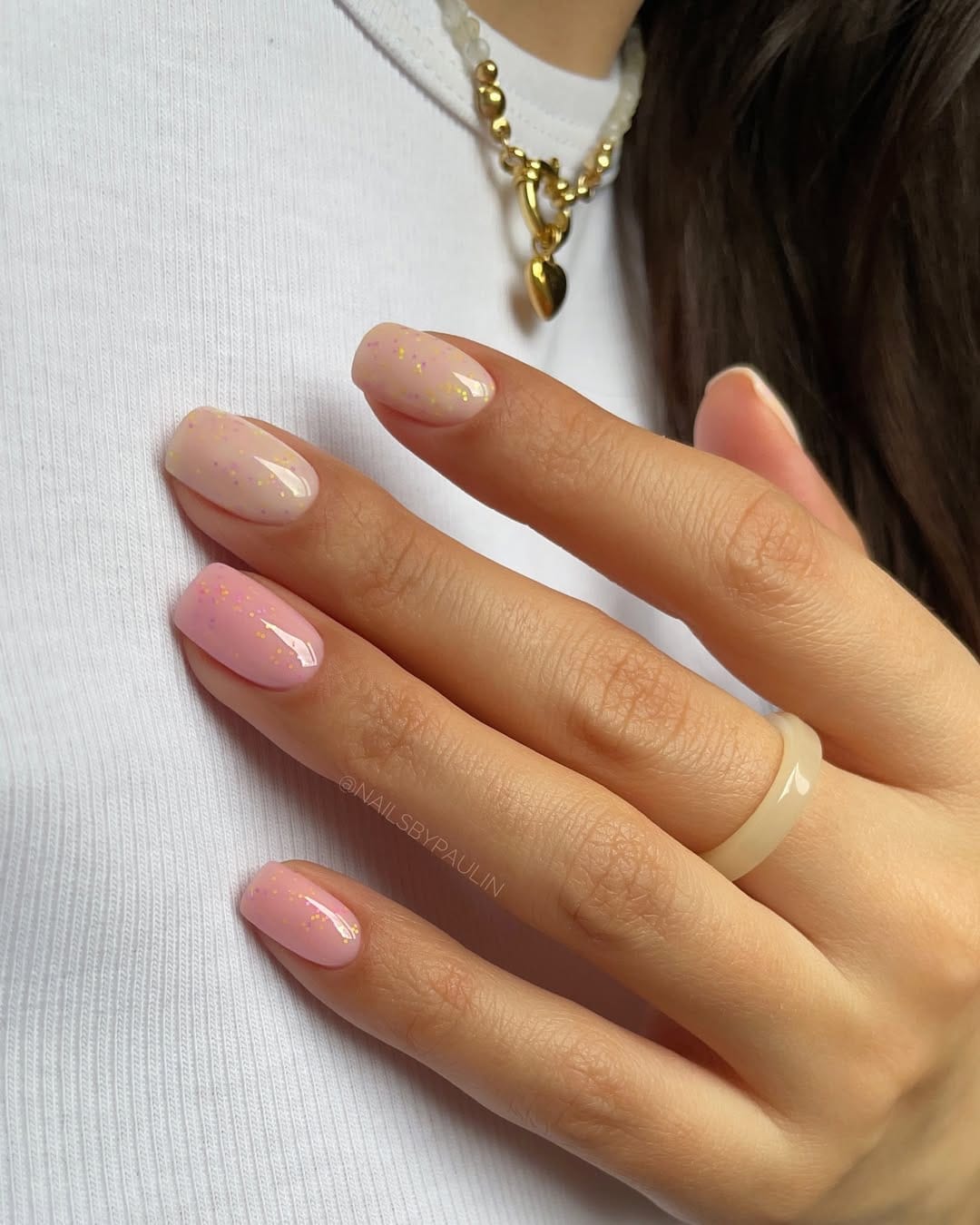 Ballet pink confetti nails with micro glitter flecks for june nails