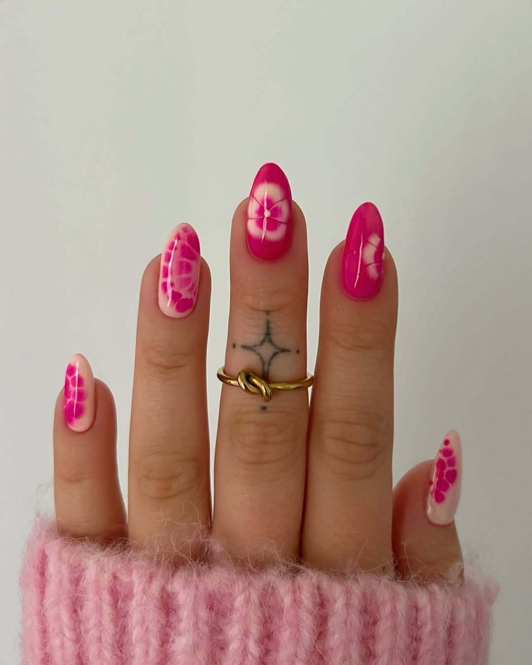 Hot pink tie-dye nails alternating with sheer blush for a june nail idea