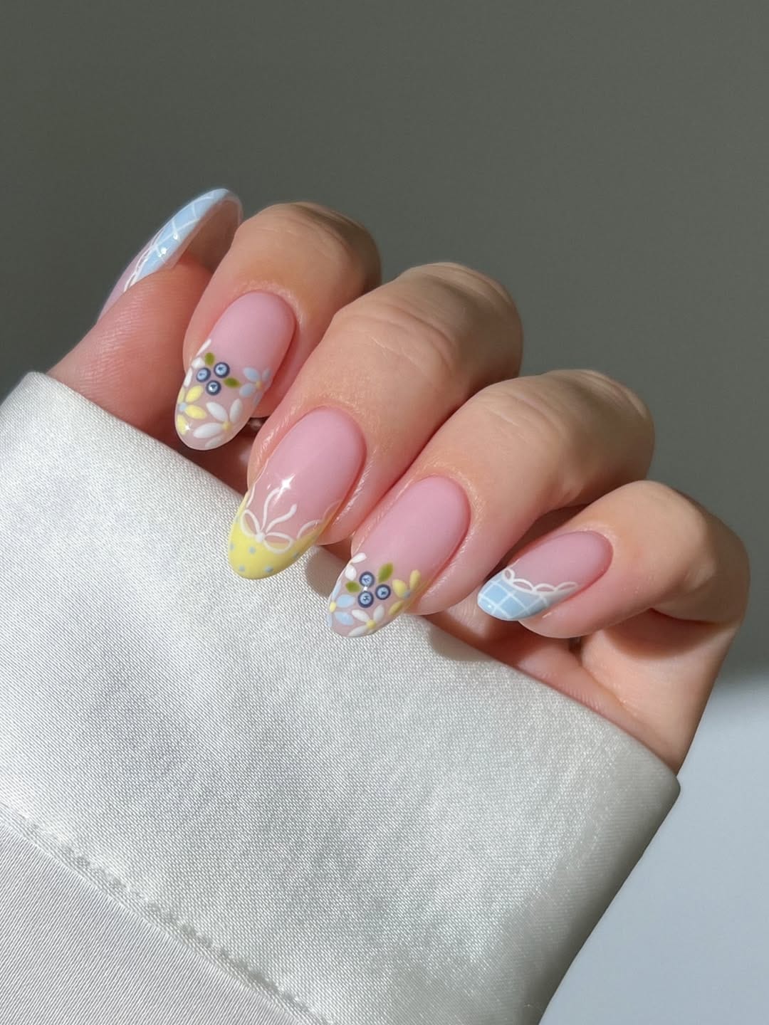 Cottage garden French nails with gingham and floral accents for june nails