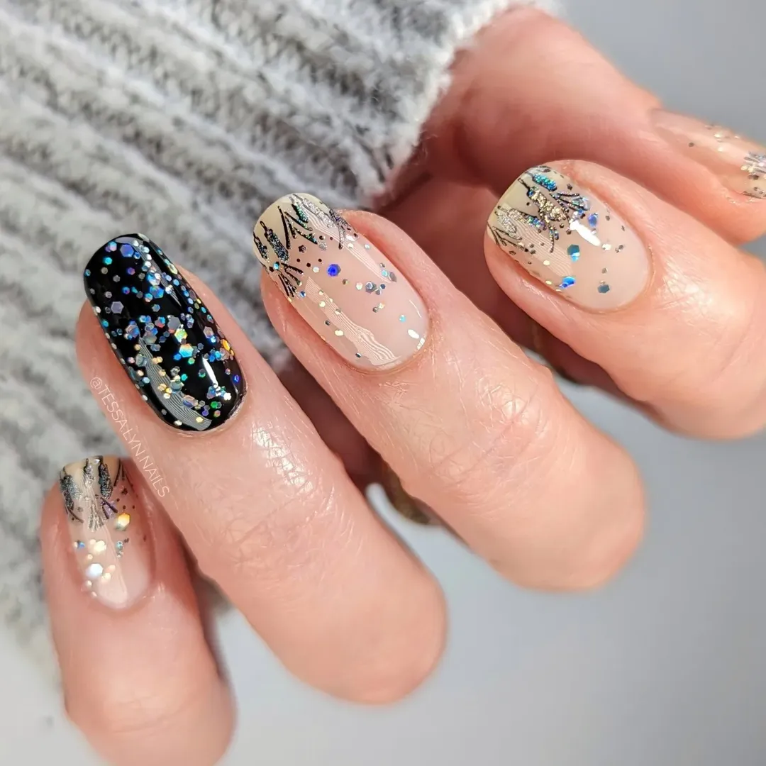 Black holographic glitter and botanical sketch nails for an edgy nail trend 2026