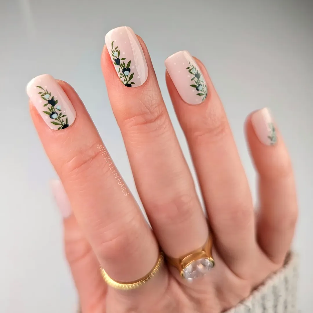 Cream base botanical sprig nail art for a delicate nail trend 2026