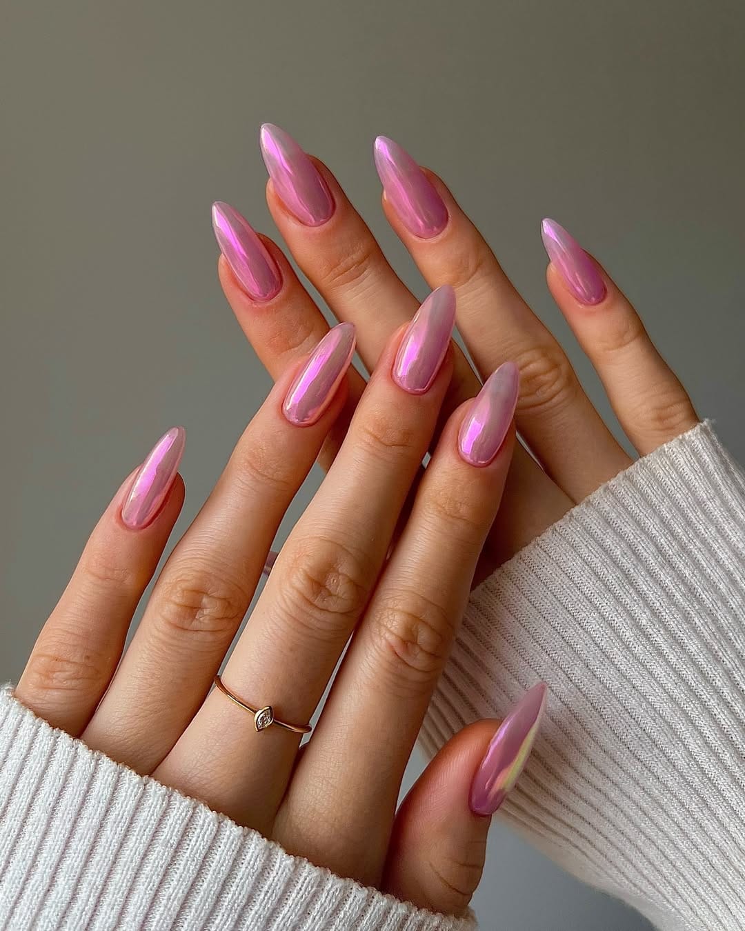 Vivid pink-purple chrome almond nails for a statement nail trend 2026