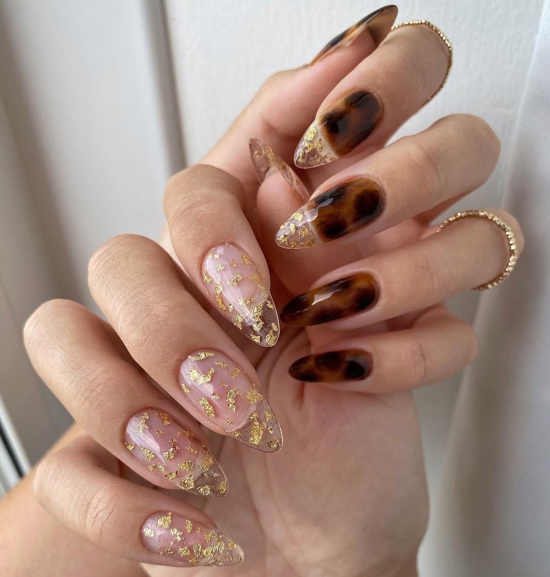 Tortoiseshell and gold foil almond nails for a luxe nail trend 2026