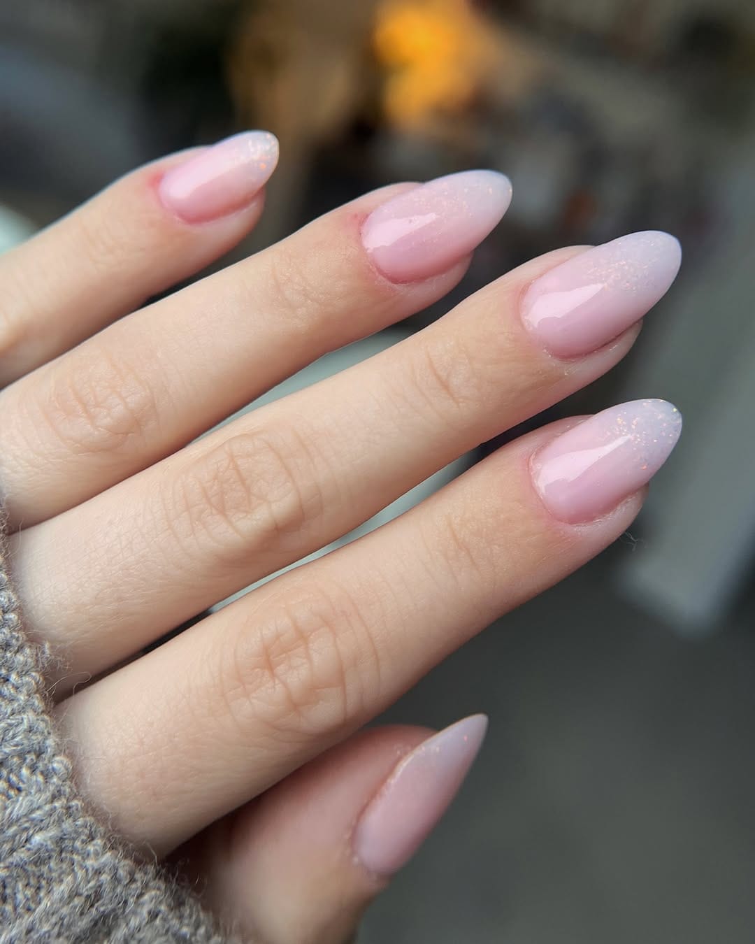 Milky pink iridescent fade nails for a glazed nail trend 2026