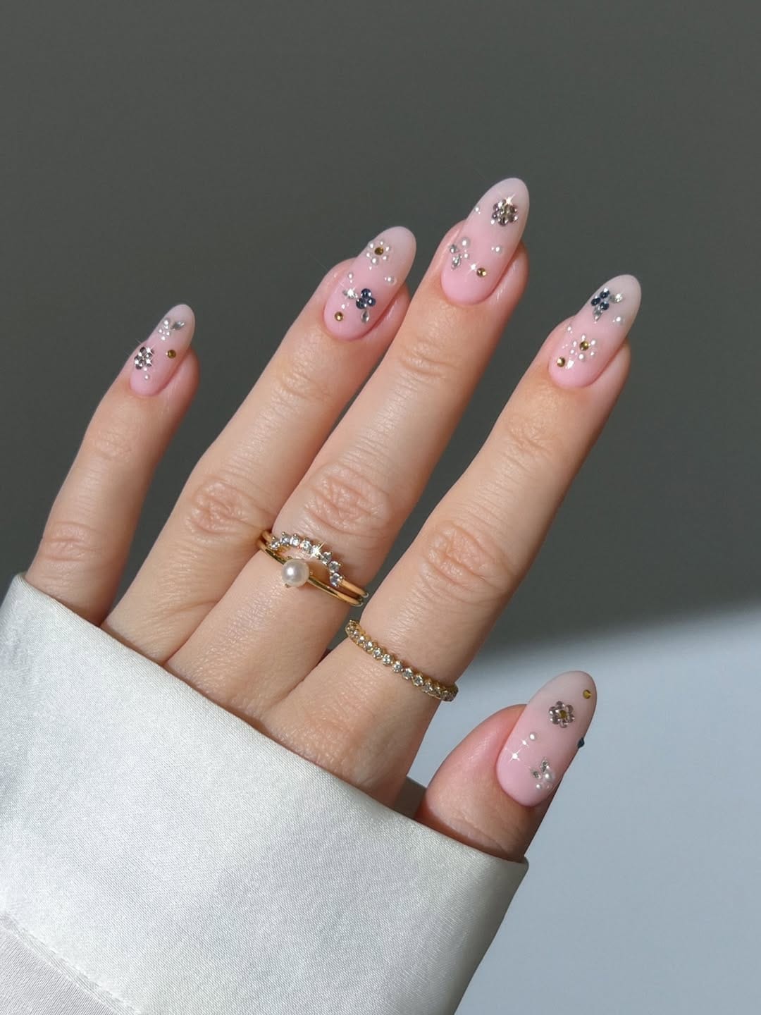 Sheer pink constellation rhinestone nails for a delicate nail trend 2026