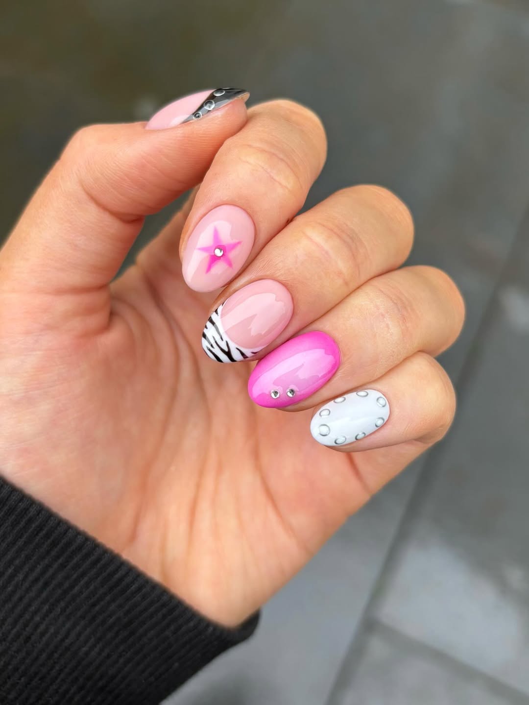 Short Y2K pink star nails with playful mix-and-match designs