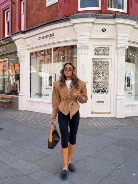 Belted suede jacket with black capri pants and penny loafers outfit