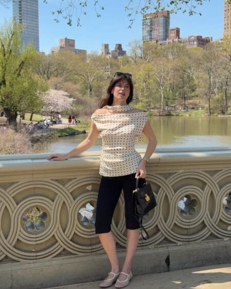 Draped polka dot top with black capri pants and Mary Jane shoes