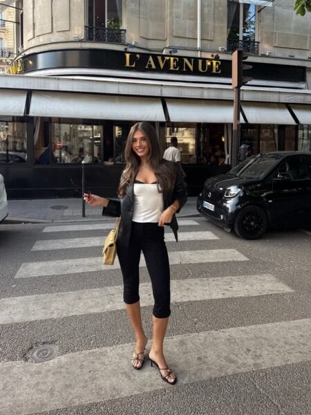 Black capri pants outfit with satin cami top and leather blazer