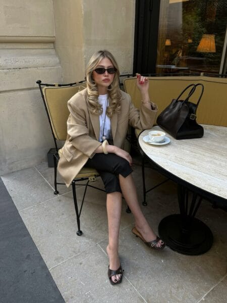 Camel oversized blazer with black capri pants and croc sandals