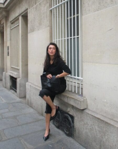 All-black knit top with satin lace-hem capri pants and kitten heels