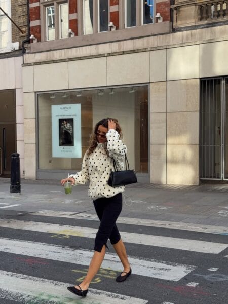 Polka dot sweatshirt with black capri pants and Mary Jane shoes