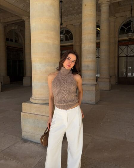 Camel cable-knit halterneck crop top with white tailored trousers July outfit