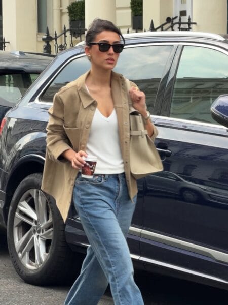 White V-neck tee with mid-wash wide-leg jeans and khaki shacket July outfit
