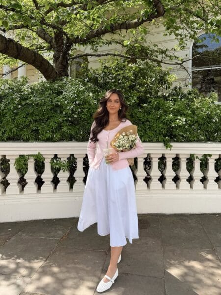 Pale pink cardigan with white cotton midi dress and white Mary Janes July outfit