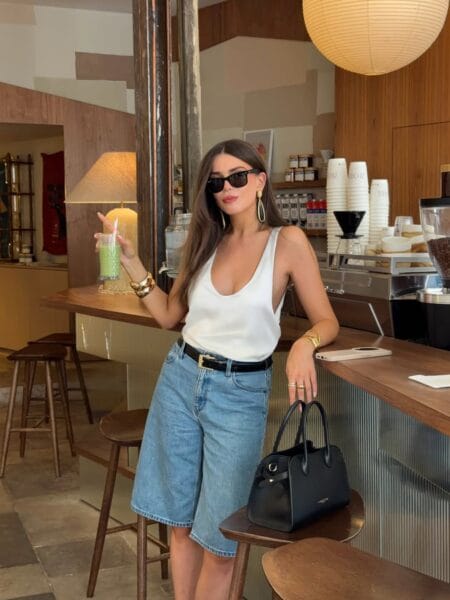 White scoop-neck tank with longline denim shorts casual July outfit