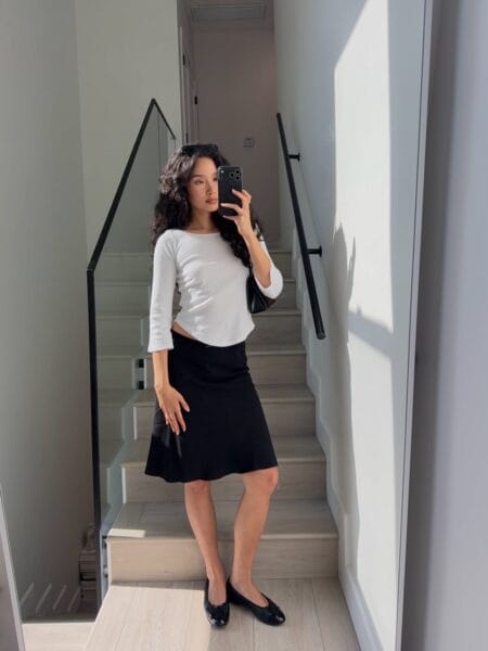 White three-quarter sleeve scoop-neck top and black A-line midi skirt with black patent ballet flats — june outfit ideas