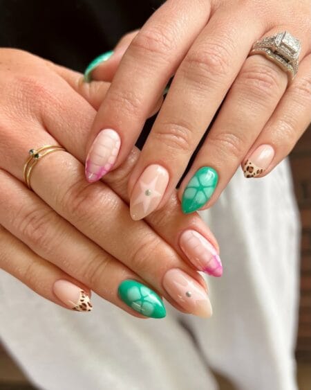 Mixed-print almond nails featuring green croc texture, pink plaid, and leopard tips.