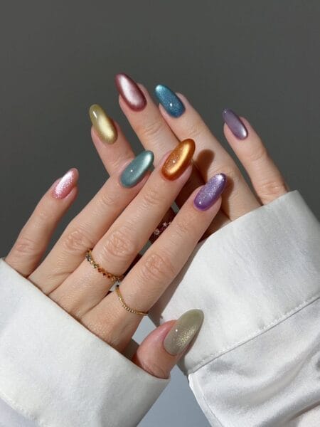 Rainbow multichrome almond nails featuring vibrant metallic color shifts.