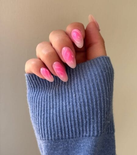 Hot Pink Swirl Aura Nails — medium almond nails with vivid fuchsia pink swirl aura ribbons over a sheer white to pink gradient base