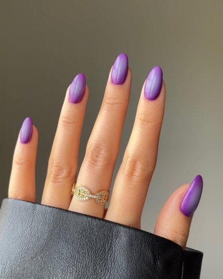 Bright Purple Aura Nails — long almond nails with vivid violet purple aura deepening from a lighter lavender base