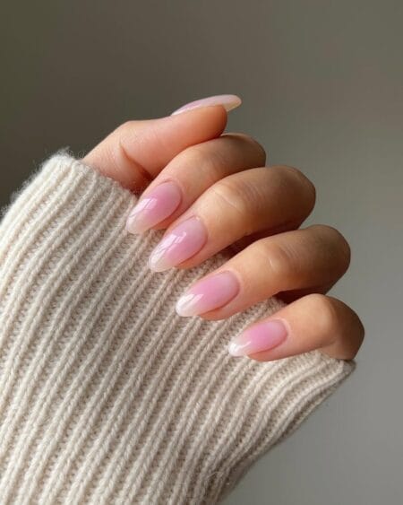 Barely There Blush Aura Nails — long almond nails with the palest rose pink aura bloom dissolving to a sheer transparent edge