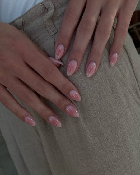 Sheer Pink Swirl Aura Nails — medium almond nails with barely there blush pink swirl aura ribbons over a translucent base