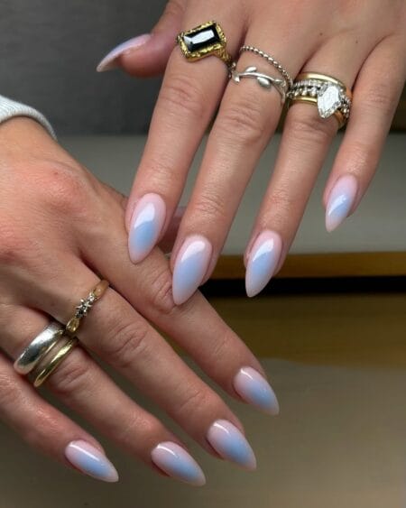 Opalescent Pink and Blue Aura Nails — long stiletto nails with blush pink and ice blue opalescent aura gradient giving a mother of pearl finish