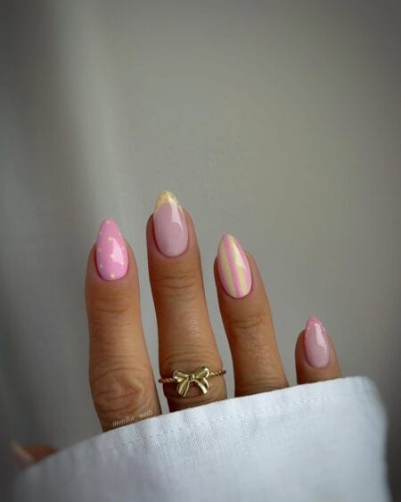 Pink and butter yellow stripe and polka dot mix almond nails with candy palette summer design