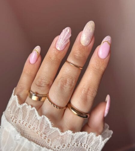 Pink seashell 3D sculpted nails with gold line French tips and opalescent foil accent