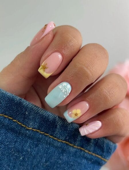 Pastel beach mix short square nails with starfish charm blue floral and shell texture accents