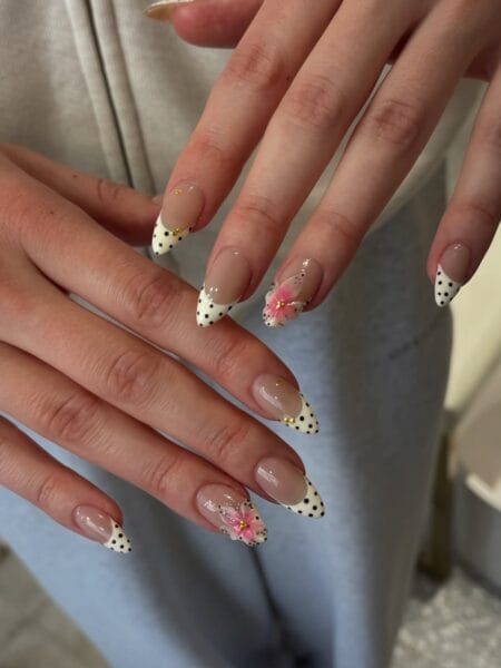 Polka dot French stiletto nails with 3D pink hibiscus flower and gold bead centre