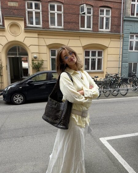 Pale yellow linen shirt with white maxi skirt modest summer outfit idea