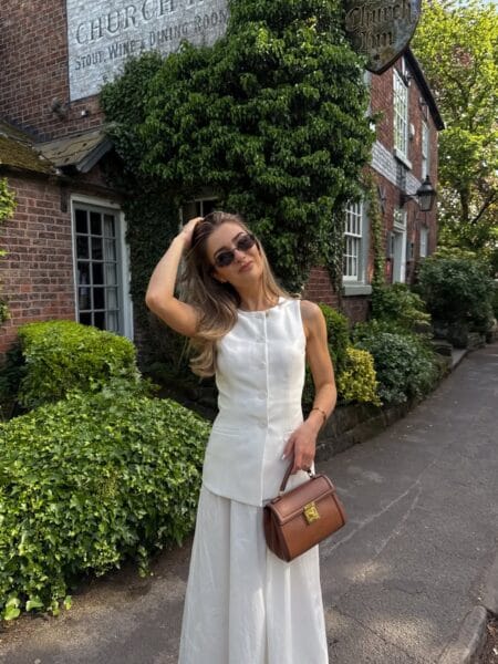 White sleeveless button waistcoat with white wide-leg trousers modest summer outfit