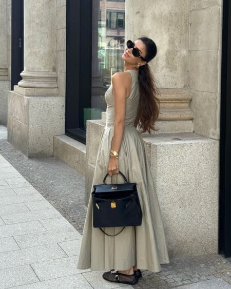 Sage green full-skirt maxi dress with black handbag modest summer outfit