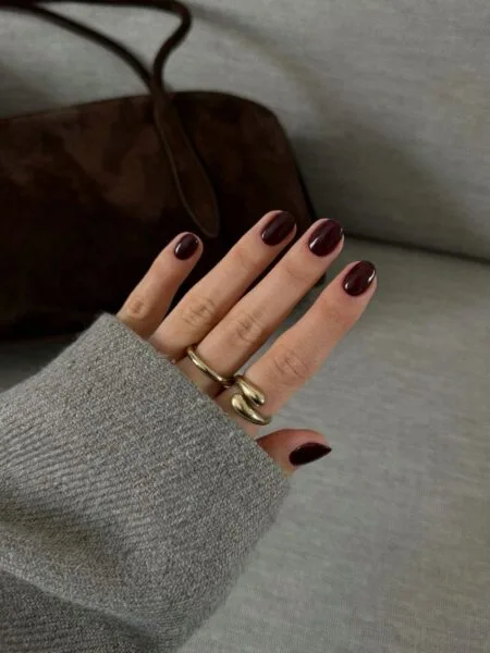 Glossy espresso brown almond nails with a rich coffee-inspired finish.