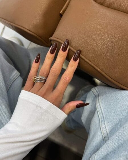 Glossy espresso brown almond nails with a rich coffee-inspired finish.