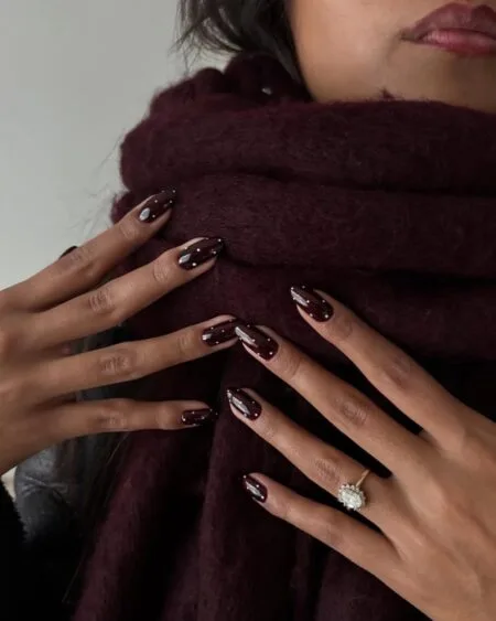 Glossy espresso brown almond nails with a rich coffee-inspired finish.