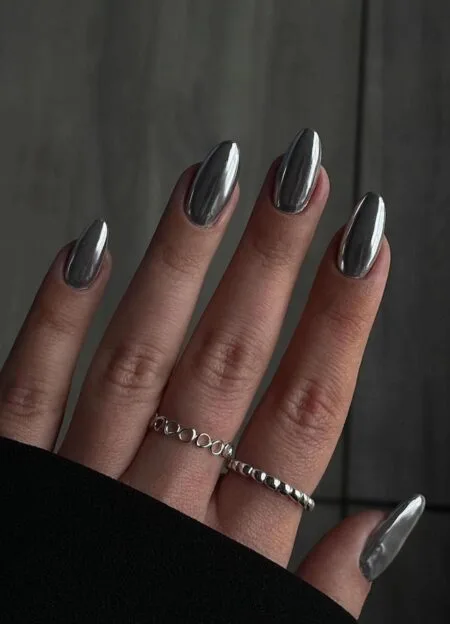 Bronze chrome nails with a reflective metallic autumn finish.
