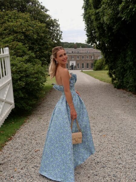 Blue floral jacquard strapless gown with ruffle neckline, fall wedding guest outfit