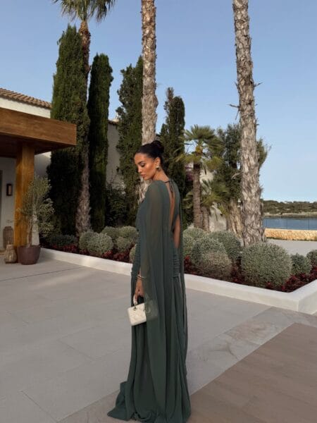 Forest green chiffon cape-sleeve gown, fall wedding guest outfit idea
