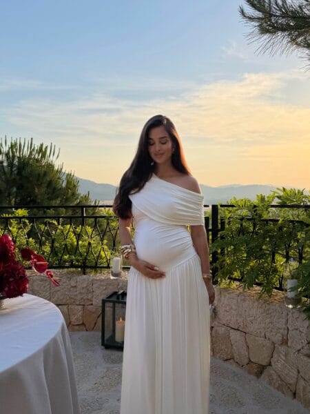 Ivory off-shoulder draped maternity gown, autumn wedding guest dress
