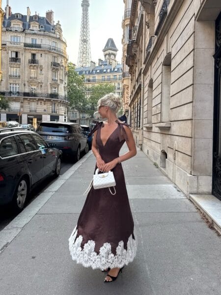 Chocolate brown satin midi dress with white lace hem, fall wedding guest outfit