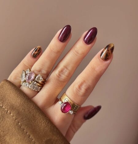 Maroon chrome nails with tortoiseshell accent fingers