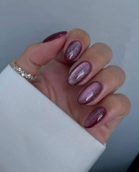 Maroon velvet cat eye almond nails